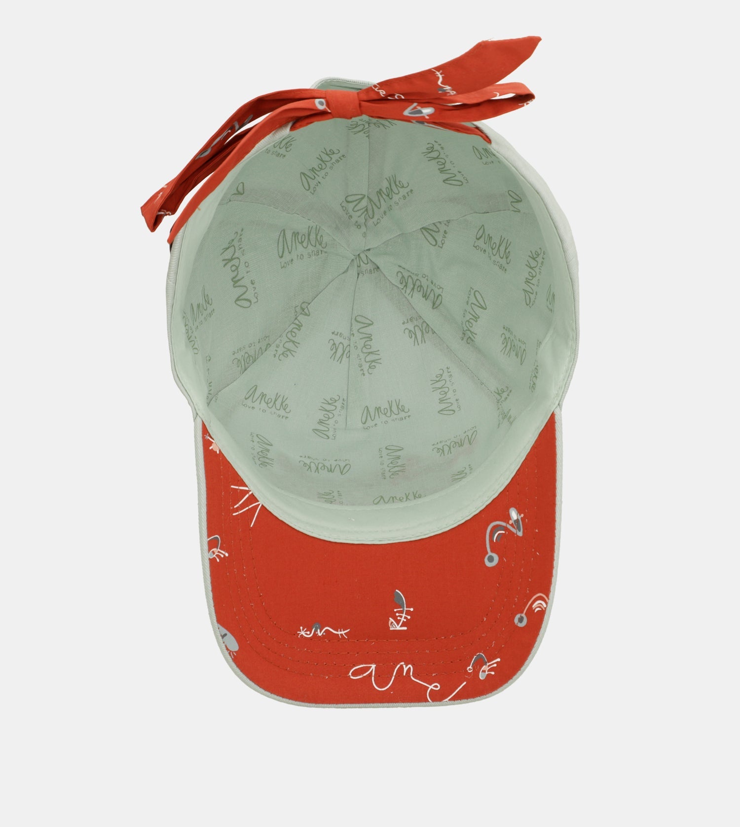 Grüne Kappe mit roter Schleife